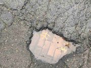 Brick Road underneath Seattle Pothole