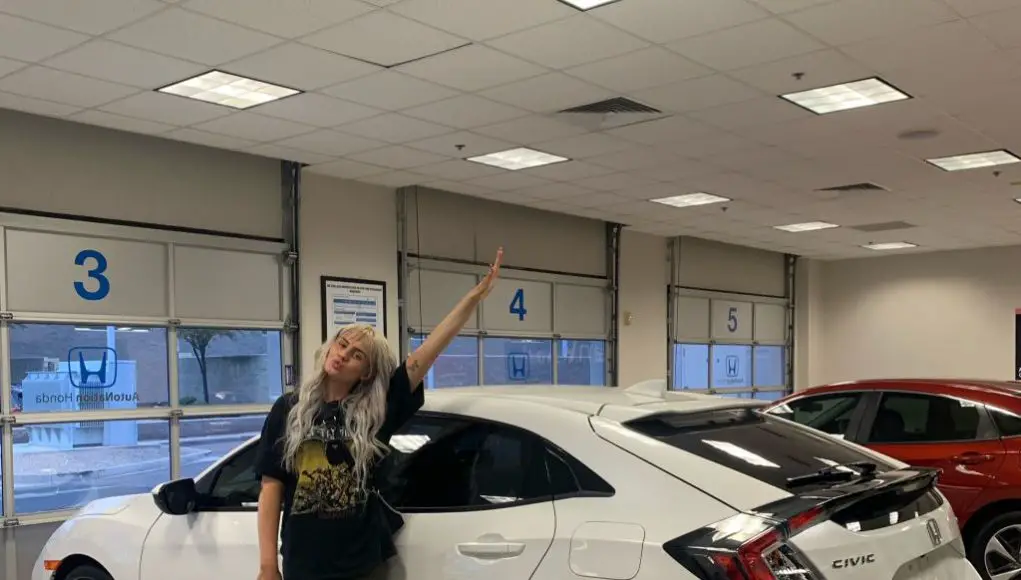 OnlyFans model poses next to her new car bought with her earnings