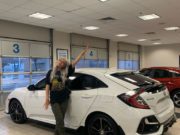 OnlyFans model poses next to her new car bought with her earnings