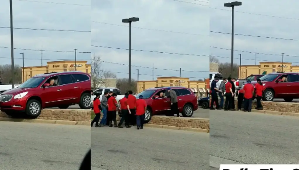 Kalamazoo Tire shop lifts Buick SUV off ledge