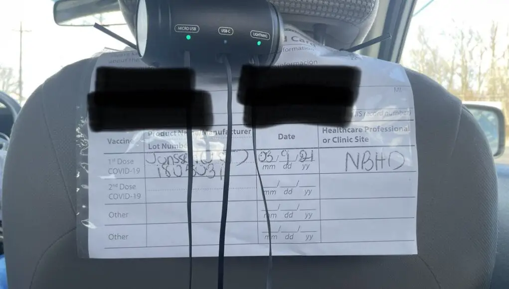 Uber driver displays Covid record