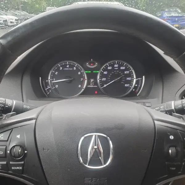 2014 Acura MDX cluster showing 634,000 miles