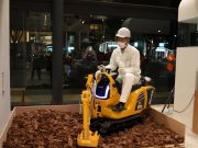 A Komatsu PC01E mini excavator demo at Honda's welcome center in Japan