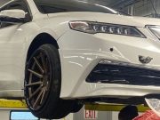 Lowered TLX on a service rack with broken front transfer case