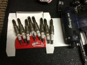 eight original spark plugs removed from a Ford Triton 3V V8 engine