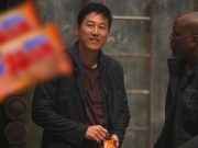 Han eating a pack of Japanese Crisps during Fast 9