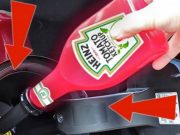 An ad showing someone squeezing ketchup into a gas tank