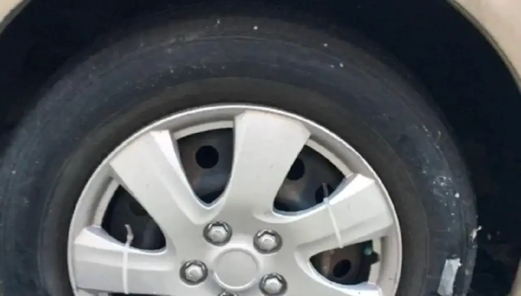 A photo of what zip ties look like on a hubcap