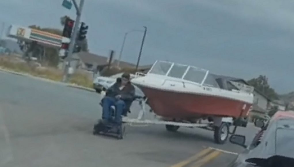 A motorized chair user in El Cajon uses his chair to tow an entire boat