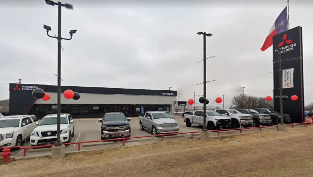 The front rowof used cars at this Fort Worth, Texas Mitsubishi dealership