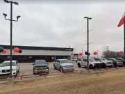 The front rowof used cars at this Fort Worth, Texas Mitsubishi dealership