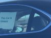 Sign on car in bay Area that says, "This car is unlocked"