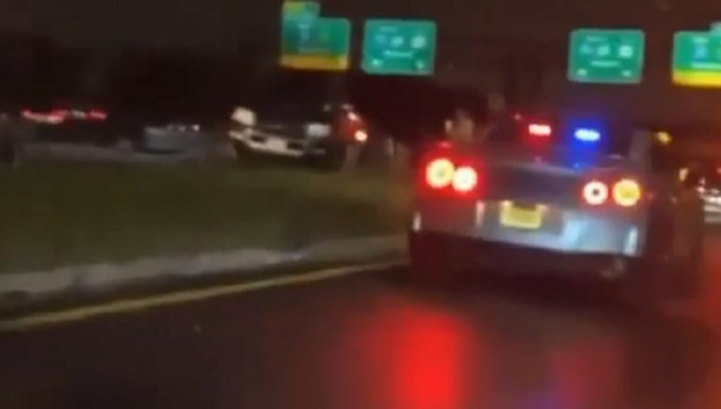 Nissan GT-R with New Jersey plates responding to a call with police lights on