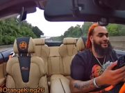 Youtuber OKA Orange King AKA OrangeKing26 films himself using his phone while driving
