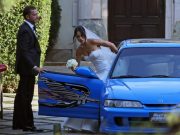 Jordana Brewster gets into a blue Acura Integra made to look like the one she drove in the first Fast and Furious