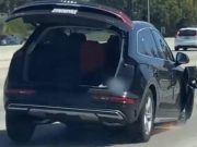 Audi SUV on three wheels on the 405 in Orange County