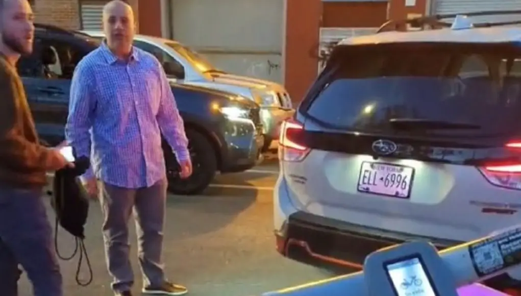 New York pedestrian on a bike refuses to let cop park on the sidewalk, obstructing traffic