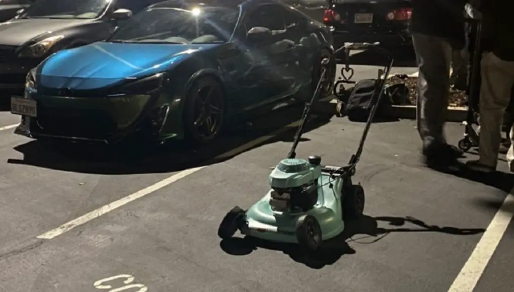 A modded Honda lawn mower parked at a Bay Area car meet
