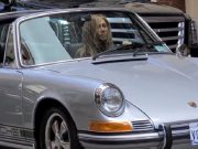 Jennifer Aniston behind the wheel of a classic Porsche 911 Targa