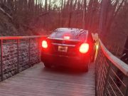 A car is stopped on the Jones Falls Trail Boardwalk