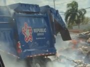 A Republic Services garbage truck on fire