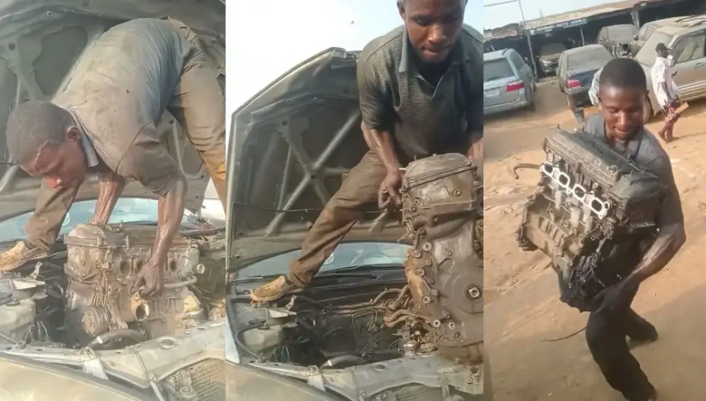 Nigerian Mechanic Samuel Ogodiema lifts an engine out of a Toyota Camry with his bare hands
