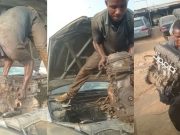 Nigerian Mechanic Samuel Ogodiema lifts an engine out of a Toyota Camry with his bare hands