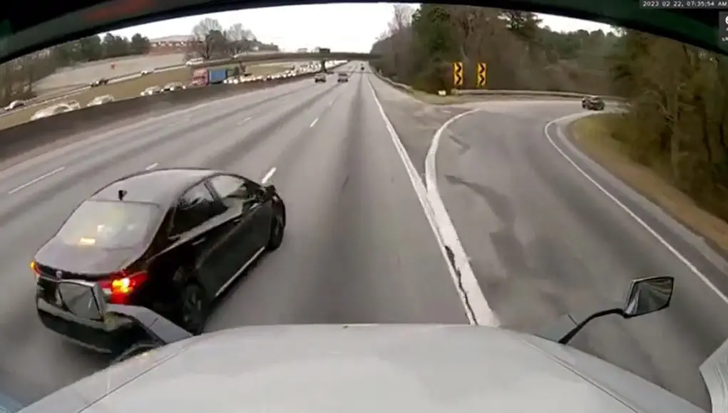Uninsured driver in Atlanta cuts in front of a semi