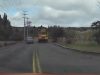 A car overtakes a school bus crossing double solid yellow lines in Battle Ground WA