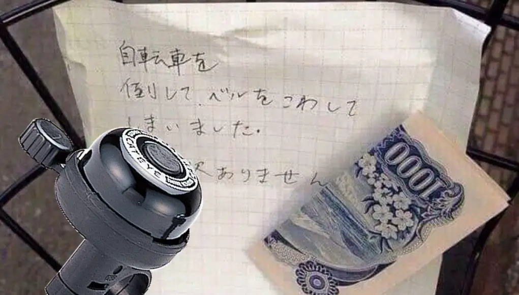 An apology note and money left for a stranger in Japan after breaking their bike bell