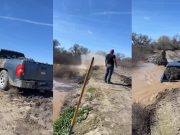 A farmer puts a truck into drive and crashes it into a broken levee