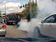 Motorcyclist in Kansas City, Mo does a burnout at an intersection.