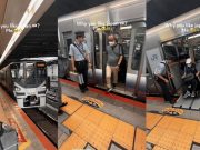Japan Railway Staff helping wheelchair bound passenger off train.
