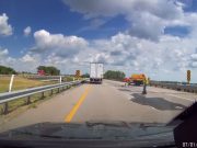 Reckless road crew works on a Nebraska highway without caution signage or traffic cones.