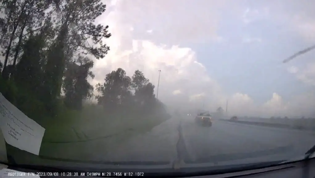 Car speeding in the rain in Bushnell, FL loses control.