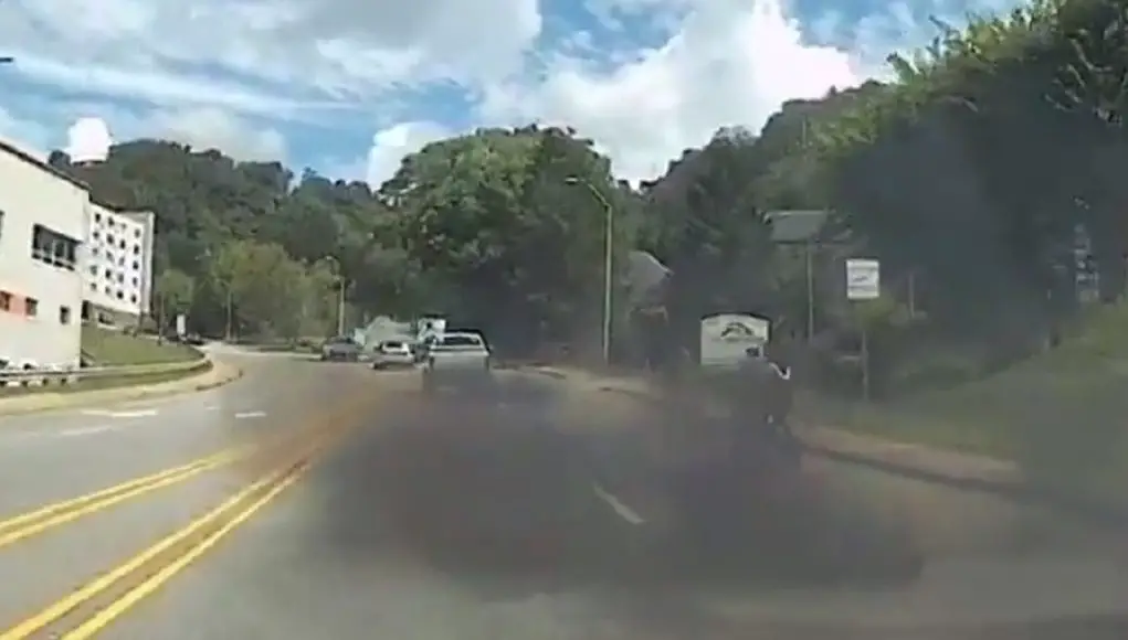 A driver in a lifted Dodge Ram rolls coal on cyclists in Asheville, NC