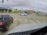 Elderly driver blows through red light in Tacoma several seconds after turning red.