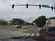 Driver in West Melbourne, FL barrels through intersection from a right turn only lane.