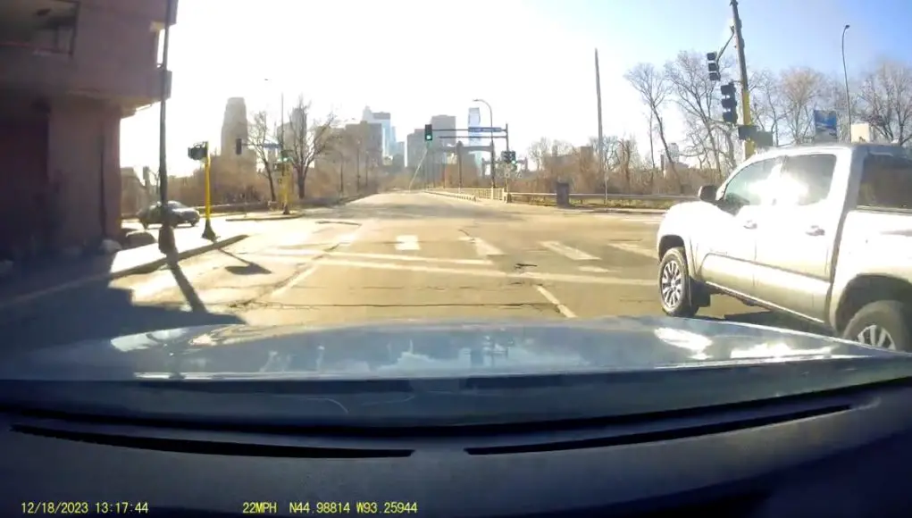 Cell phone user and red light runner in Minneapolis