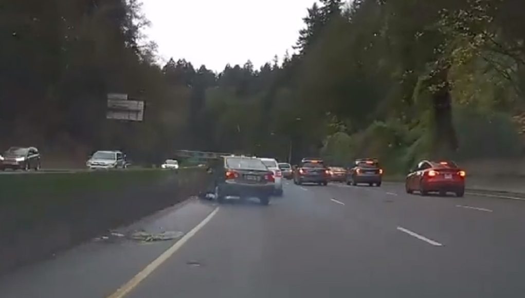 Texting while driving driver in Portland on the Sunset HIghway causes accident.