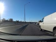 Driver in a full size van on the MoPac Expressway pulls a dangerous overtake manuver.