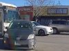 Prius cuts in front of RTD articulated bus in Denver turning right.