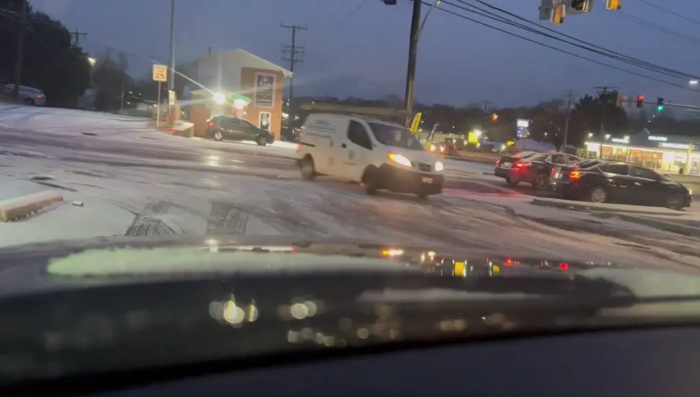 Work van stops just in time going down this icy road in Rosedale, MD.