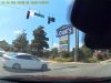 Driver in Ocala, FL makes an illegal U-Turn on red from a driveway.