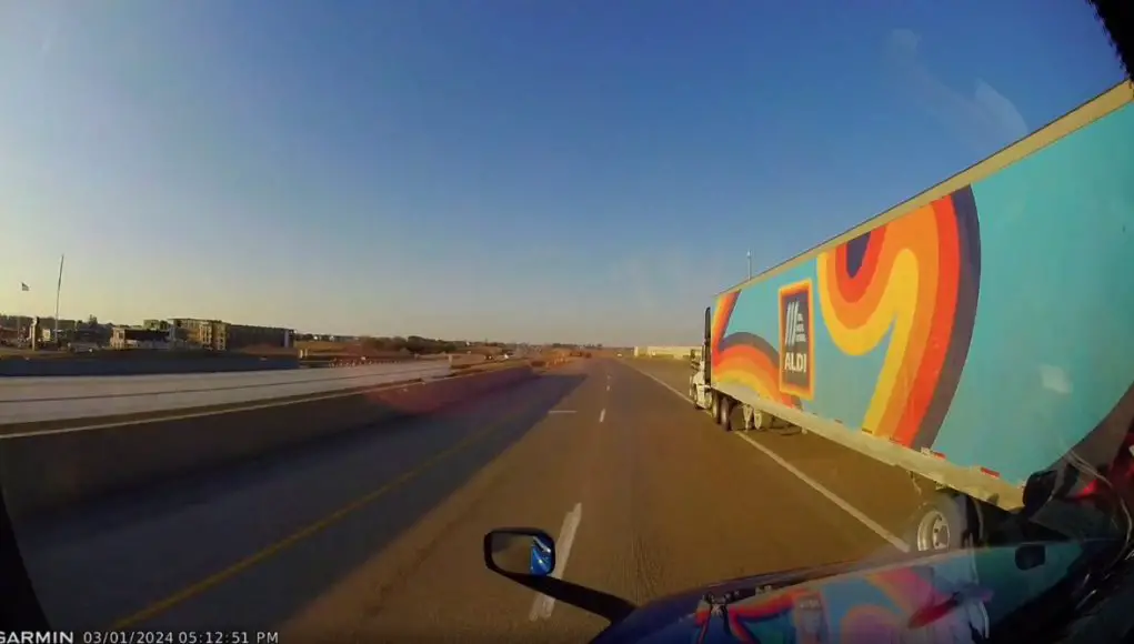 Trucker refuses to yield to Aldi trucker committed to passing on the right.
