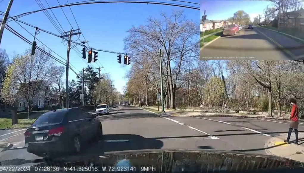 Driver in New Haven, CT runs red light to not save time.