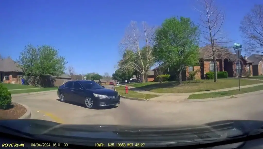 Driver enters roundabout the wrong way in Norman, OK.