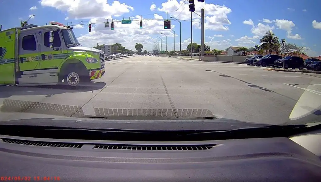 Car rear ended in Miami after yielding to emergency vehicle.