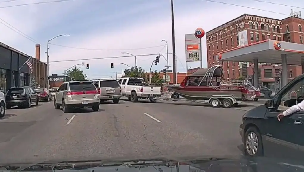 truck towing jet boat in Spokane WA recklessly pulls out into traffic