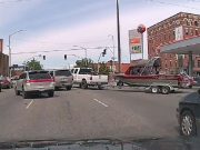 truck towing jet boat in Spokane WA recklessly pulls out into traffic